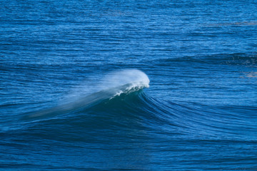 Perfect wave breaking perfectly in Nazare Portugal