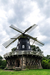 Fototapeta na wymiar Windmill in a Kungsparken and Slottstradgarden, parks in Malmo, Sweden