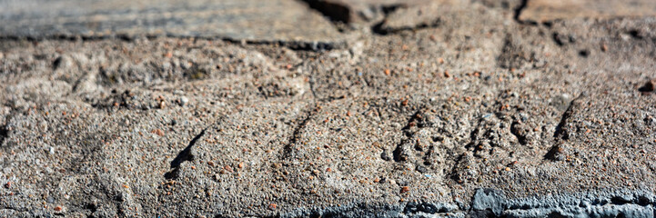 Long background with industrial sand with tire marks