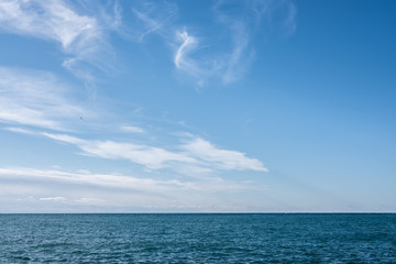 Blue waves crashing on a rocky shore