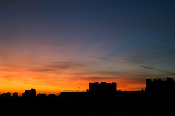 Orange sunset and cloud over cityscape, Europe.