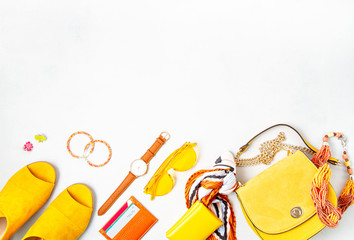 Flat lay with woman fashion accessories in yellow colors. Fashion blog, summer style, shopping and trends idea