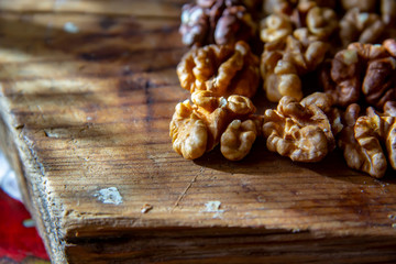 tasty healthy peeled walnuts on a wooden board