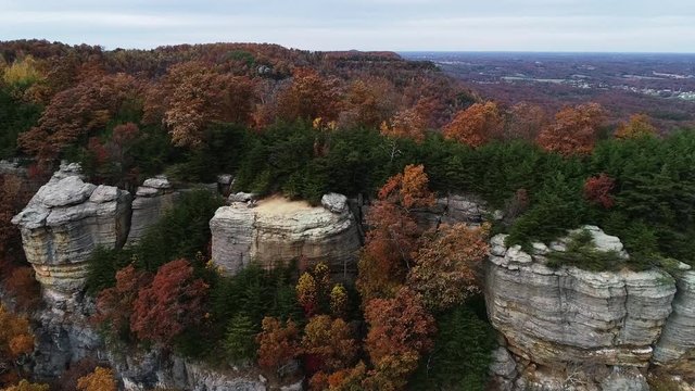 Cliffs in Daniel Boone National Forest during autumn, panning aerial