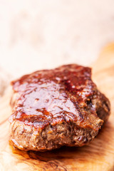 grilled juicy steak on olive wood