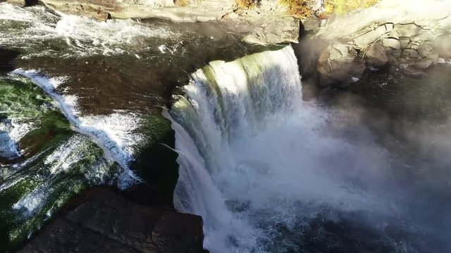 Panning aerial, cascading Cumberland Falls in Kentucky