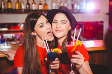 Two young girls lesbians at a party in the club.
