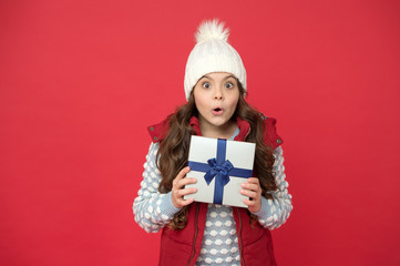 Receiving surprise present concept. Gift for female. Send parcel. Delivery service. Xmas gift idea. Winter holidays. Kid girl winter outfit hold wrapped gift box. Spark joy. Christmas gifts