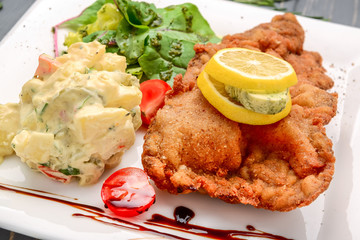 Wiener Schnitzel with potato salad and lemon