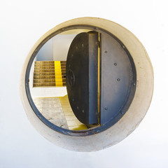 Stylized submarine hatch door Metal and concrete