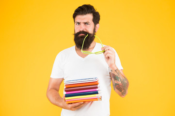 Creative hipster. Personal diary. Freak student. Education for adults. Hipster eccentric student hold pile books. Study hard. Language courses. Buy stationery. Adult student. College textbooks