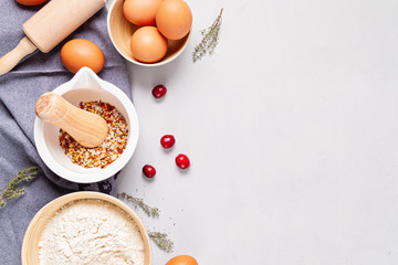 Rustic baking ingredients and kitchen utensils. Homemade pastry, baking. Top view flat lay background. Copy space. Healthy fresh organic food.