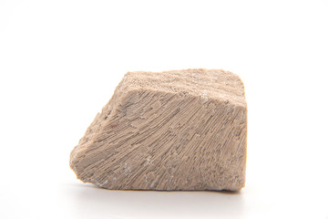 Limestone isolated on white background, Limestone is a carbonate sedimentary rock that is often composed of the skeletal fragments of marine organisms such as coral, foraminifera, and molluscs.