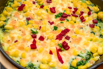 healthy diet. Casserole with potatoes, corn, green peas and spinach and cheese