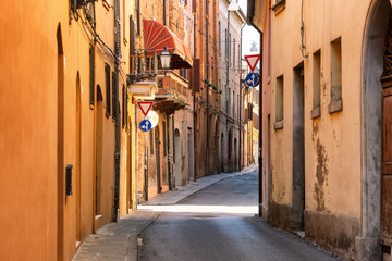 Obraz na płótnie Canvas Narrow medieval street in Ferrara, Italy