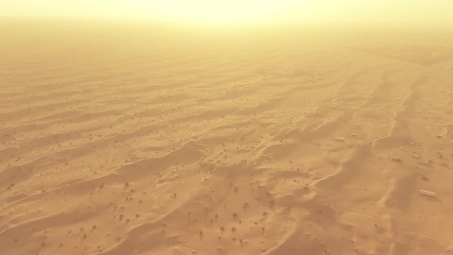 Aerial view of sand dunes in a hot desert in the United Arab Emirates