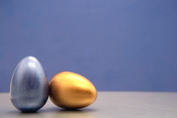 Cozy Set blue and silver Easter eggs on blue background.