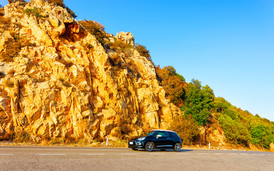 Car on road in Porto Cervo at in Sardinia Island in Italy summer. Transport Driving on the highway...