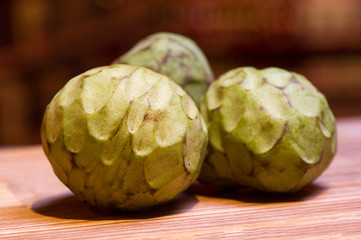 Obraz premium sale of exotic cherimoya fruits, still life on the market