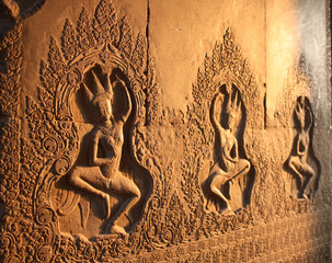 patterns on the wall of an old temple in cambodia