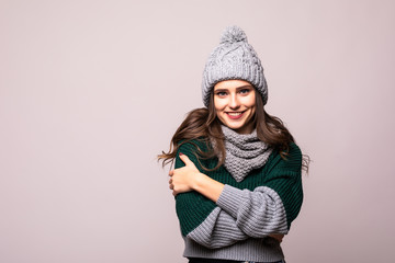 Young young woman with winter hat over isolated white background