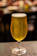 Misty glass with pint of cold Scotch ale, pale ale draft beer in English pub