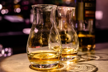 Scotch whisky, tasting glasses with variety of single malts or blended whiskey spirits on distillery tour in Scotland
