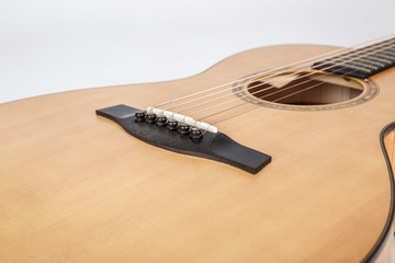 wood texture of lower deck of six strings acoustic guitar on white background. guitar shape