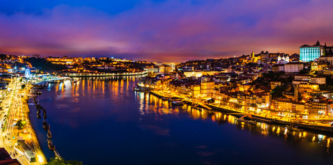 Fototapeta premium Porto city skyline, night cityscape panorama from Luis I bridge of Porto, Portugal
