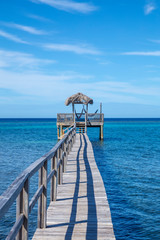Fototapeta premium Wood construction on top of the Caribbean Sea on Roatan Island. Honduras