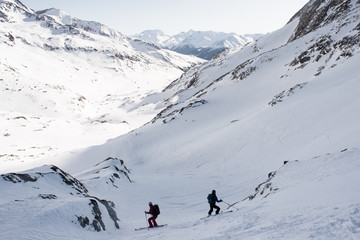skiers in the mountains