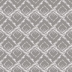 Gordijnen Naadloze geometrische patroon met witte ruiten op een grijze achtergrond. © Yuliia