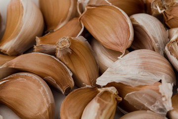 Fresh garlic cloves, top view. Food background, texture