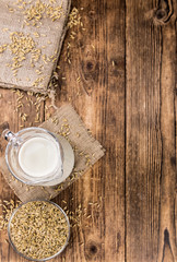 Portion of fresh Oat Milk (selective focus; close-up shot)
