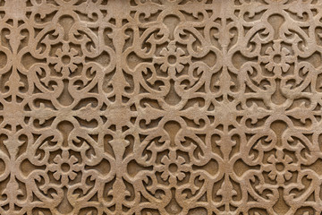 Geometrical pattern on wall.  Decorative detail with flower elements
