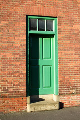 Green Door Entrance to Brick Built House