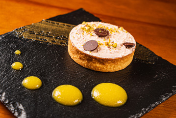 lemon tart with chocolate  in the restaurant