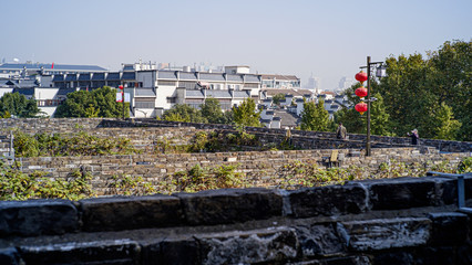 chinese small town in front of a city wall