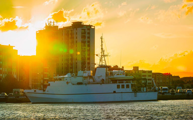 Harbor with Luxury ship at sunset or sunrise and Mediterranean Sea in Old city of Olbia on Sardinia...