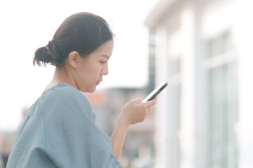 A girl searching some data from her smartphone