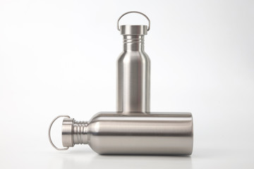 metal steel water flasks on white background. metal drinking utensils