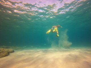  underwater man snorkeling in the sea withcrystal-clear waters concept of holiday relax summer...