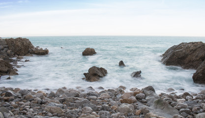 Fototapeta na wymiar Beach of rocks in the coast