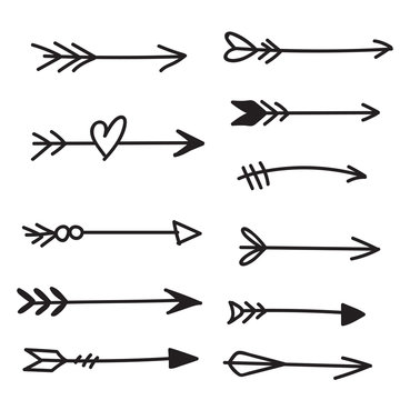 Doodle hand drawn bow arrows set isolated on white background