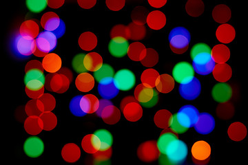 Red and orange, green, blue bokeh. Abstract background. Dark background.