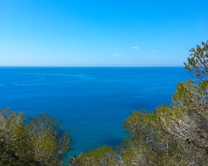 Fototapeta na wymiar Clear blue sky on the Mediterranean Sea with wide open horizon