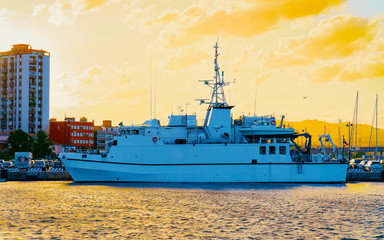 Harbor with Luxury ship at sunset or sunrise and Mediterranean Sea in Old city of Olbia on Sardinia...