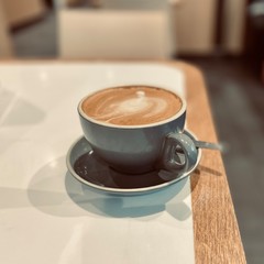 cup of coffee on wooden table