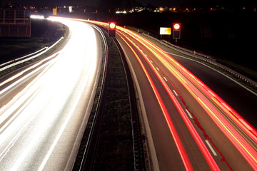 Fototapeta na wymiar Long exposure of car lights on a freeway in the night.