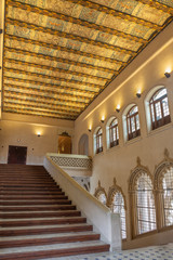 ZARAGOZA, SPAIN - MARCH 2, 2018: The hall and stairs of La Aljaferia palace with the painted ceiling.